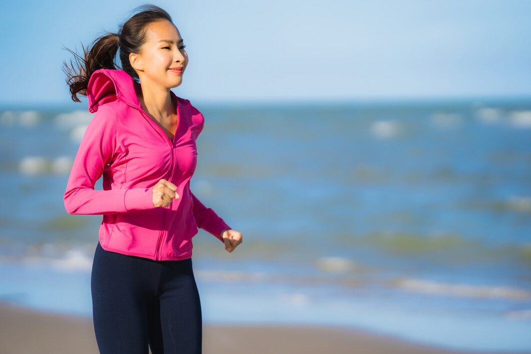 portrait-beautiful-young-asian-woman-running-exercise-tropica-nature-landscape-beach_74190-8574